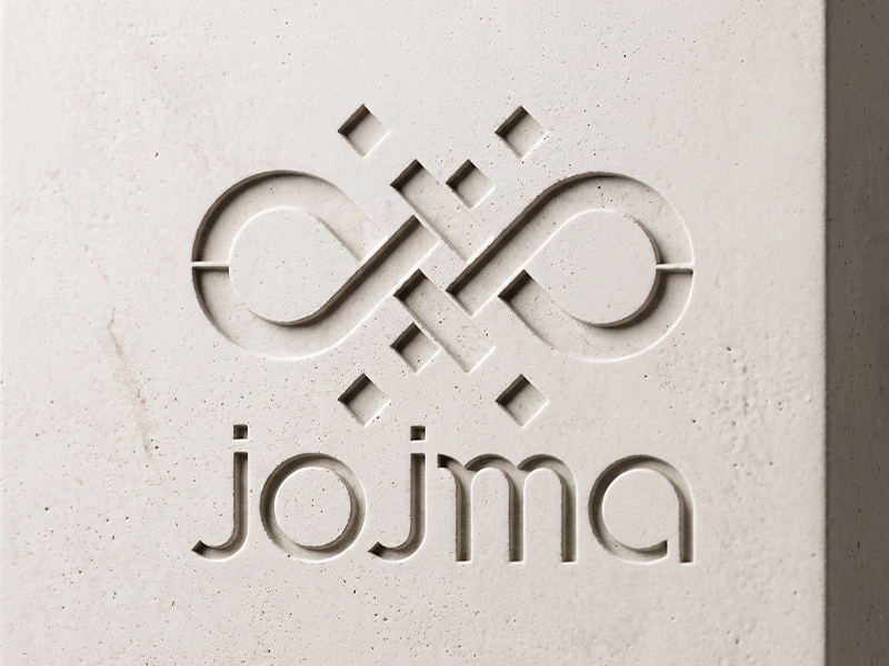 Surface minérale en GRC clair avec logo JOJMA gravé en relief négatif